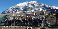 Students enjoying a meal on Mt Kilimanjaro